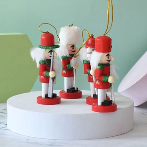 Set of four 10cm Nordic wooden nutcracker soldier ornaments with red and white festive details