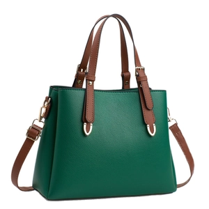 Green litchi grain leather Boston bag with brown handles and gold hardware details