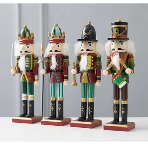 Detailed close-up of four wooden Christmas nutcracker soldiers with swords and drums