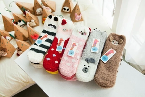 Detail of five thick coral fleece animal socks including panda and rabbit designs