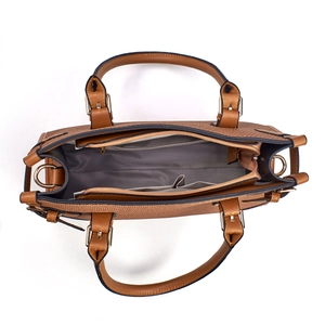 Detail view of the vintage brown handbag interior with herringbone lining and compartments