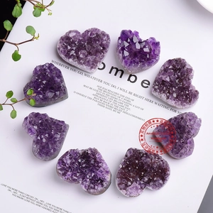 Macro shot of heart-shaped natural amethyst clusters with deep purple crystal texture