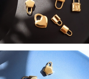 Detailed view of assorted heart and star-shaped 18K gold plated heart lock pendants