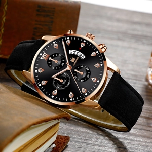 Macro detail of men's business watch with crystal markers and rose gold case on leather