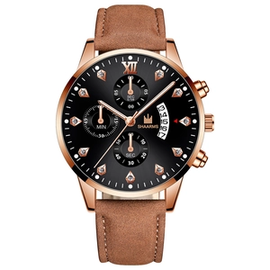 Detail of rose gold watch case with Roman numeral XII and chronograph subdials