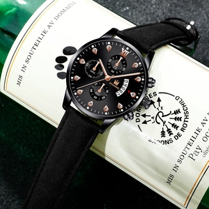 Detailed view of SHAARMS men's watch with black dial and sub-dials on a green bottle