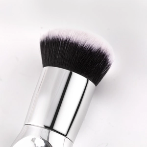 Detail of soft dual-tone fiber bristles and polished silver ferrule on large foundation brush