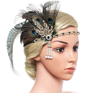 Detail of a 1920s vintage peacock feather headband with rhinestones and pearl tassels