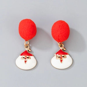 Detail of Christmas earrings featuring red plush pom-poms and Santa Claus pendants