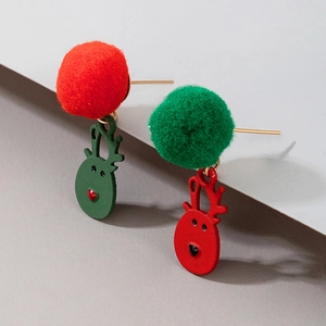 Detail of Christmas earrings featuring red and green pom-poms with cute reindeer charms