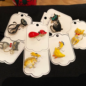 Charming enamel animal brooches with cats and ducks featuring sparkling crystal accents