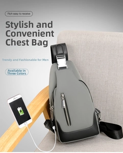 Detail of grey waterproof sling bag with USB charging port and metal buckle closure