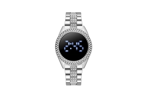Close-up of silver rhinestone digital watch with blue LED display on white background