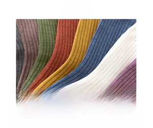 Macro detail of breathable ribbed cotton fabric in various colors for slouchy socks