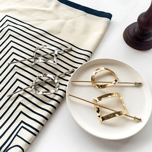 Elegant geometric metal hair sticks in gold and silver finish for sleek hair styling