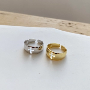 Detailed view of S925 sterling silver open rings with hollow cross design in gold and silver