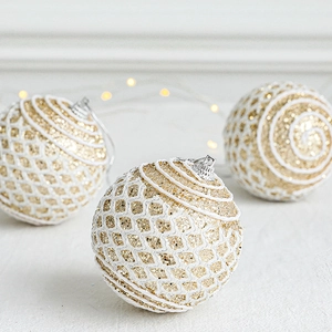 Golden and white Christmas ornament balls with glitter and 3D mesh for holiday decor