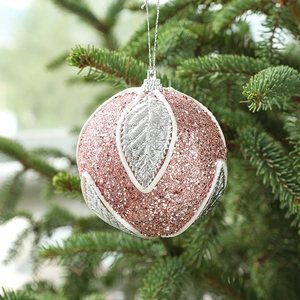 Pink 8cm glitter Christmas ball ornament with silver leaf design on green pine branches