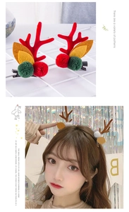 Close-up of cute Christmas reindeer antler hair clips with felt texture and plush balls