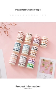 Flat lay of 10 gradient polka dot washi tape rolls for DIY scrapbooking decor