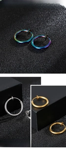 Macro view of stainless steel spring clip earrings in silver, gold, and rainbow finishes