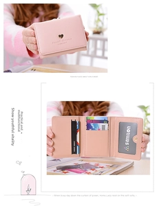 Detailed views showing pink trifold wallet with gold heart buckle and card slots