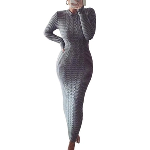 Detail of grey cable knit long sleeve dress showing slim fit design and texture
