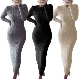 Detail view of knit textures in grey, black, and beige cable knit long sleeve dresses