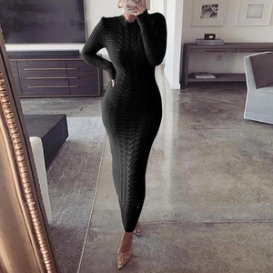 Detail shot of the cable knit texture and slim fit design of this black long-sleeve maxi dress