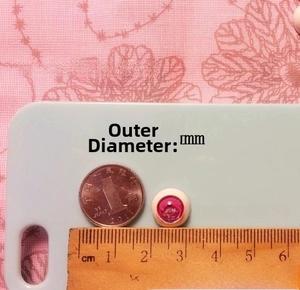 Detailed view of pink 12mm resin doll eyeball accessory with outer diameter measurement