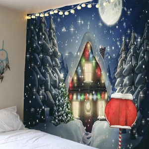 Cozy Christmas wall tapestry featuring a snowy cabin and pine forest at night with warm lights