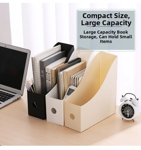 Close-up of slanted desktop file organizers in white and black with round pull holes