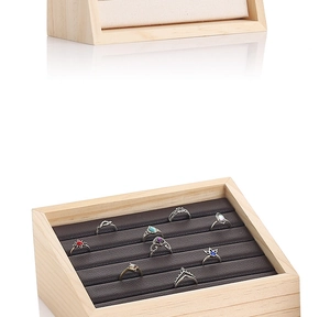 Detailed view of wooden jewelry display box with microfiber ring slots and natural grain