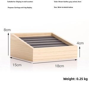 Macro detail of solid wood jewelry display tray with dimensions and five-row slot design
