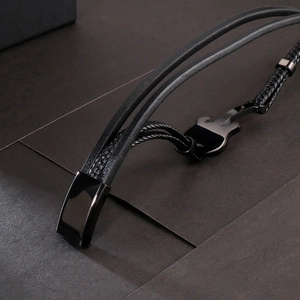Men's multilayer black leather braided bracelet featuring a titanium steel guitar pendant