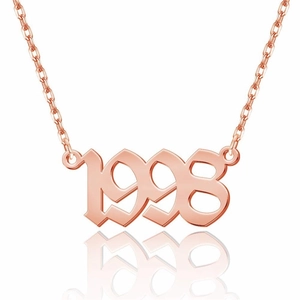 Close-up of 1998 birth year pendant necklace in rose gold with gothic font on white backdrop