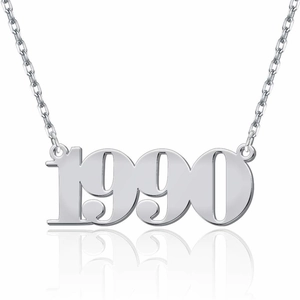Macro detail of custom 1990 birth year pendant in silver stainless steel finish