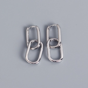 Detailed view of silver S925 sterling silver interlocking oval link earrings on gray background