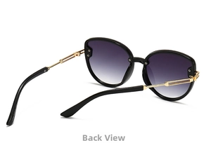 Detail view of cat eye sunglasses featuring gold metal temples and purple gradient lenses