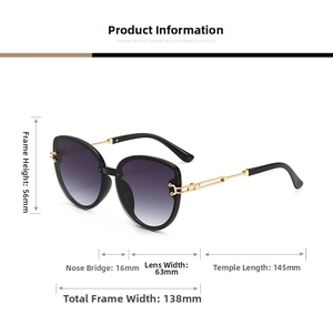 Close-up of cat-eye sunglasses with purple gradient lenses and hollow gold metal temples