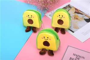 Close-up of cute plush avocado coin purse with embroidery smile and metal keychain