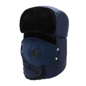 Detail of navy blue winter bomber hat with thick faux fur lining and air valve mask
