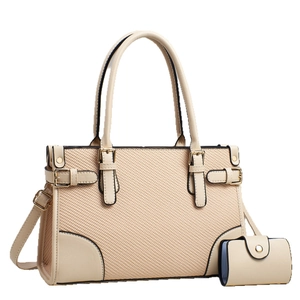 Elegant off-white textured tote bag with smooth leather trim and adjustable shoulder strap