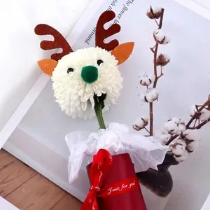 Christmas DIY reindeer chrysanthemum decoration in festive red gift box with ribbon