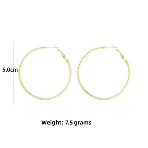 Detailed size view of 5.0cm large gold hoop earrings weighing 7.5g with latch closure
