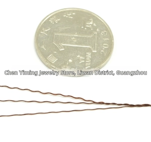 Detailed view of wavy brown high-strength polyester thread for DIY jewelry making