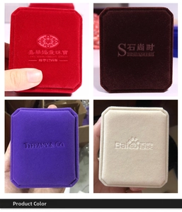 Detailed view of rectangular velvet jewelry boxes in red, brown, purple and beige colors