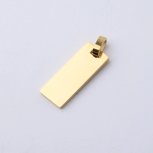 Close-up of polished gold rectangular metal pendant with smooth mirror surface for engraving