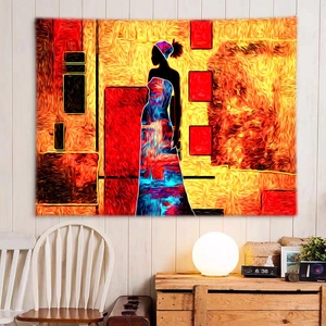 Detailed view of large ethnic African silhouette tapestry on a white wooden wall