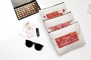 Three-piece Valentine's Day canvas makeup bags with festive prints and zipper closure